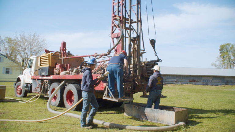 A team of well drillers